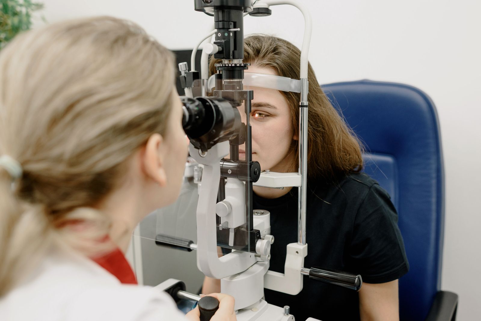 Ophthalmologist examining a patient's vision with clinical equipment