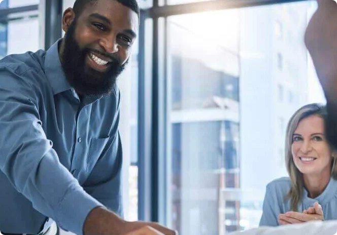 Business team welcoming a customer