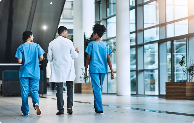Eye care professionals walking through a clinical facility